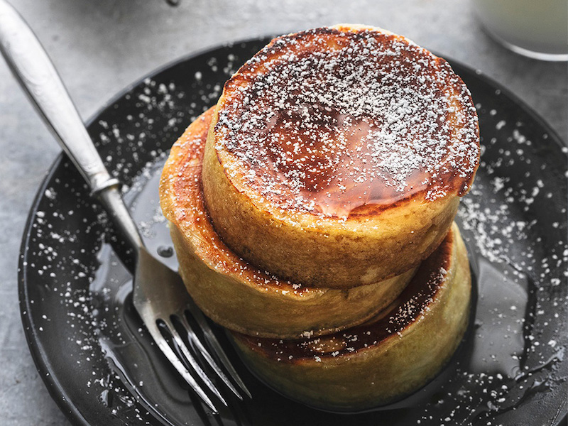 Japanese souffle pancakes with syrup served with milk