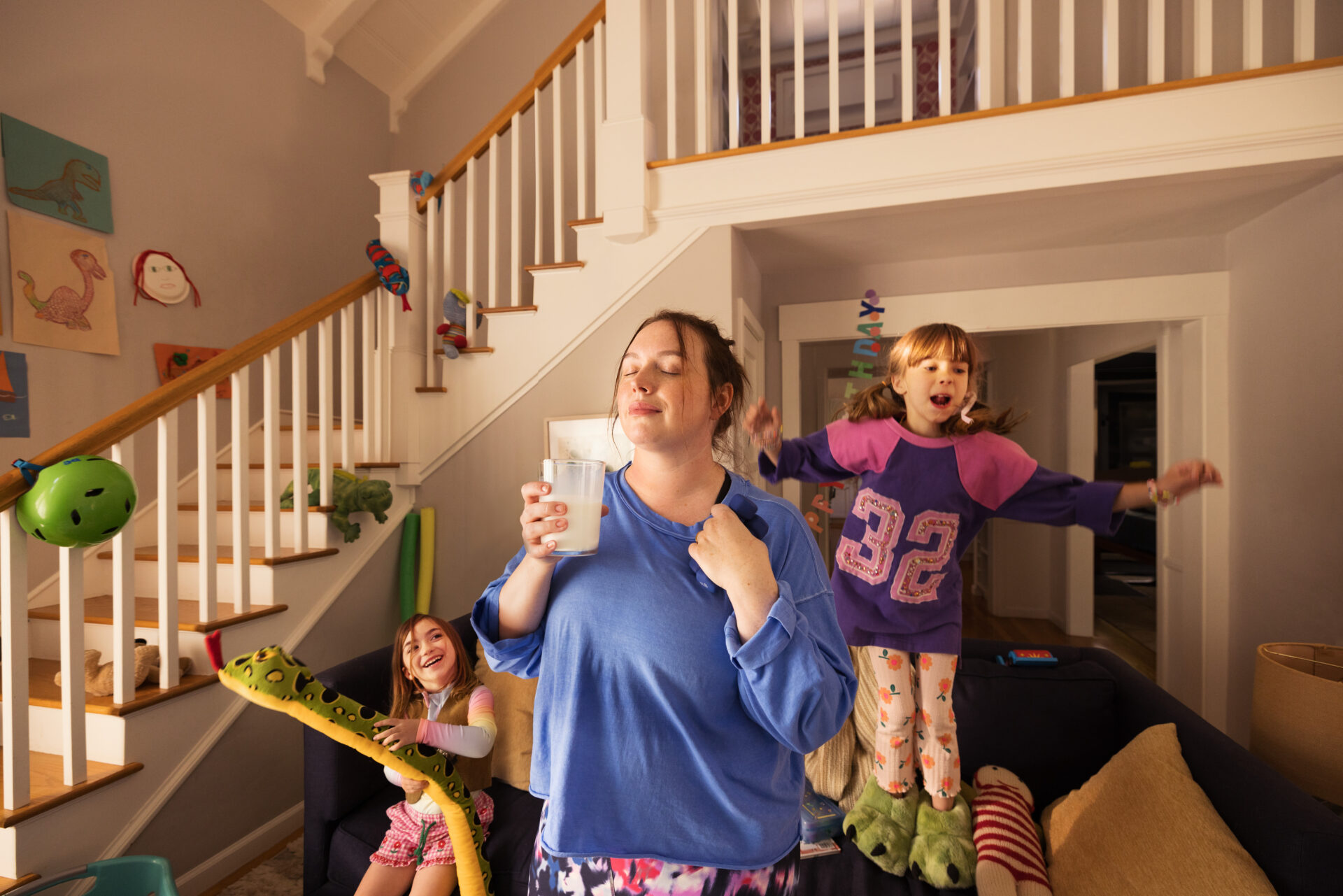 Mom drinks milk after a workout with her kids. Mom drinks milk after a workout with her kids.