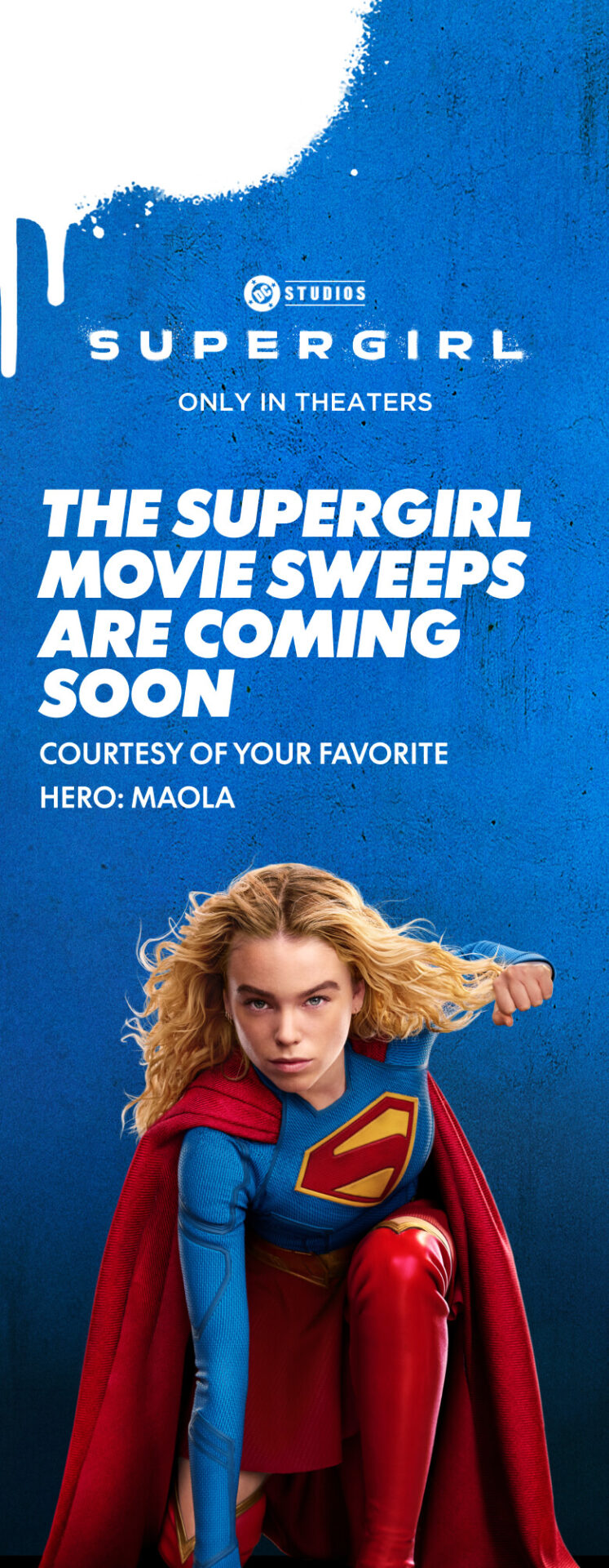 Supergirl crouches on the ground with her left hand curled into a fist.